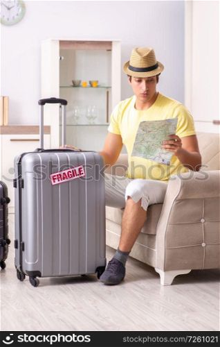 Man going on vacation with fragile suitcases. The man going on vacation with fragile suitcases