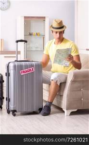 Man going on vacation with fragile suitcases. The man going on vacation with fragile suitcases