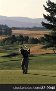 Man Golfing on Golf Course