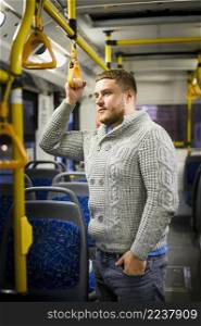 man gray blouse jeans traveling by bus