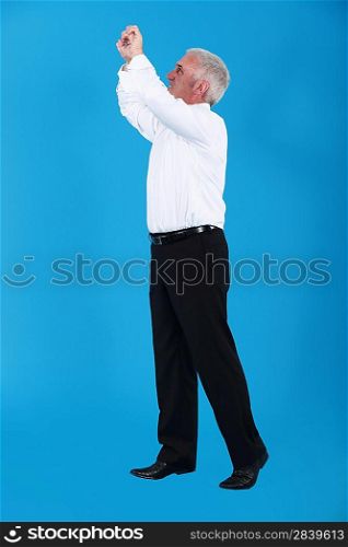 Man gripping an invisible bar