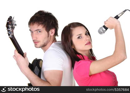 Man guitarist and woman singer on white background