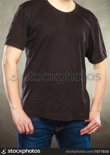 Man guy in blank shirt with empty copy space.. Fashionable man in black blank shirt with empty copy space. Guy in studio on black. Casual fashion advertisement.