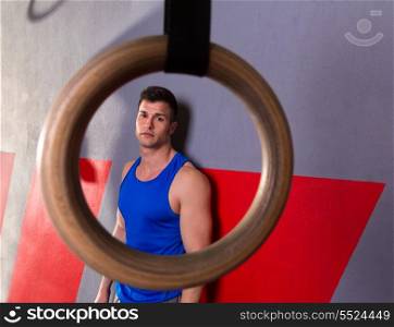 Man gym ring view relaxed after gym workout on wall