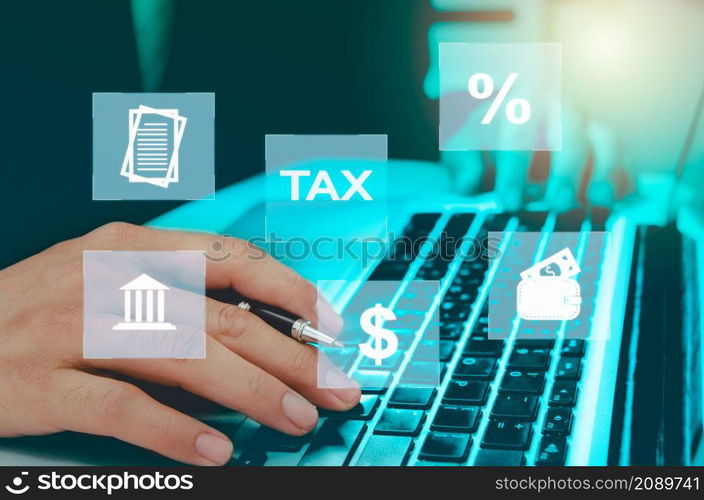 Man hand computer laptop virtual icon business tax. Business finance, investment and online tax payment. Technology concept on the Internet.