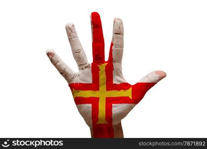 man hand fist painted country flag of guernsey