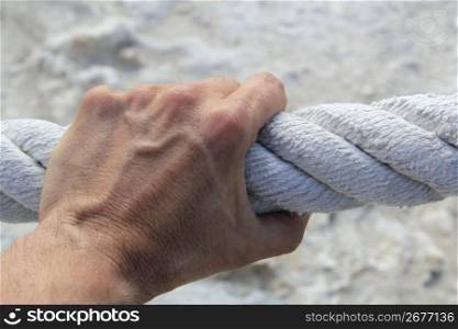 man hand grab grip holding strong big aged marine huge rope