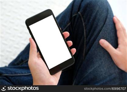 Man hand holding black smart phone with blank screen on background for mock up, template, technology and lifestyle