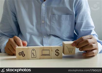 man hand holding cube on table online shopping marketing icon business concept