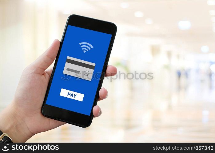 Man hand holding smart phone with online banking payment device on screen, business and technology and lifestyle