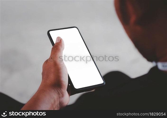 Man hand holding smartphone mock up blank screen for advertising text