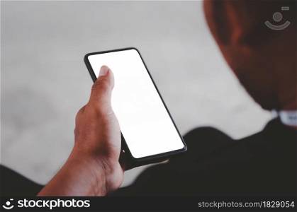 Man hand holding smartphone mock up blank screen for advertising text