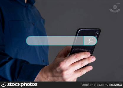 Man hand holding smartphone with virtual screening searching icon for Web search engine concept.. Man hand holding smartphone with virtual screening searching.