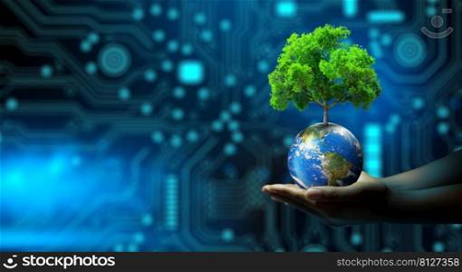 Man hand holding Tree on Earth with technological convergence blue background. Green computing, csr, IT ethics, Nature technology interaction, and Environmental friendly. Elements furnished by NASA.