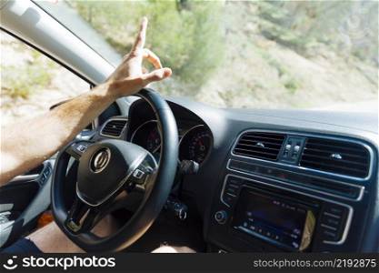 man hand steering wheel