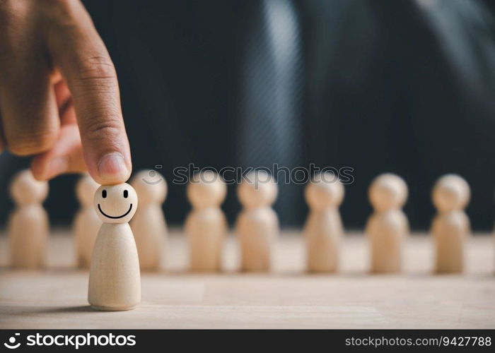 Man hand touches wooden human figure. HR officer seeks leader and CEO. Leader steps out of crowd. Personal development, motivation, challenge. HR, HRM, HRD concepts. Human Resource Management.