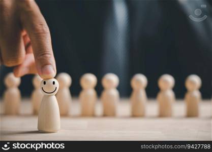 Man hand touches wooden human figure. HR officer seeks leader and CEO. Leader steps out of crowd. Personal development, motivation, challenge. HR, HRM, HRD concepts. Human Resource Management.