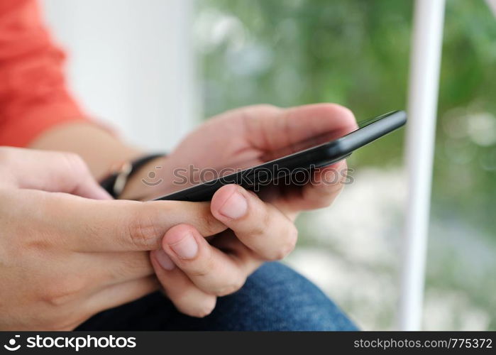 Man hand using black smart phone, people on phone, technology and lifestyle