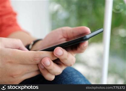 Man hand using black smart phone, people on phone, technology and lifestyle