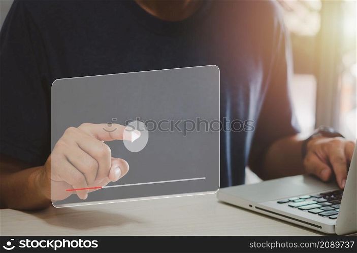 Man hand using computer laptop touch virtual search icon watching video on internet. modern Internet technology , Social Networking, online marketing, digital online. concept technology