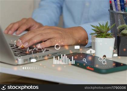 man hand using laptop to working social media marketing icon internet network technology and business concept