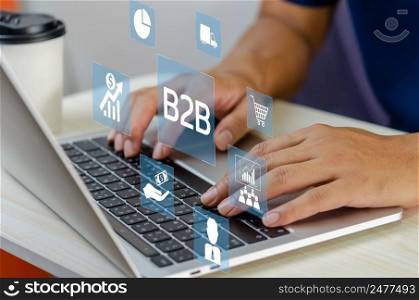 man hand using laptop virtual screen B2B Business to Business icons and symbols. Business Technology Marketing concept.