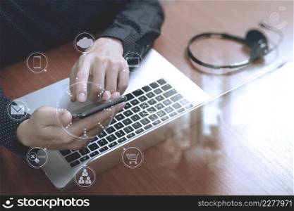 Man hand using VOIP headset with digital tablet computer docking smart keyboard, concept communication, it support, call center,screen graphic virtual icons,graph,diagram