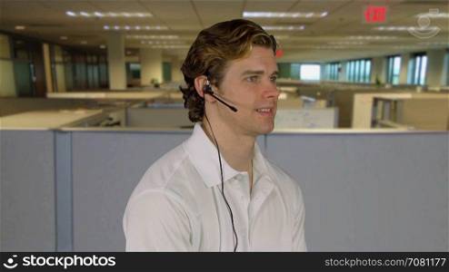 Man handles customer call at work