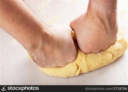 man hands kneading dough