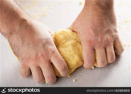man hands kneading dough