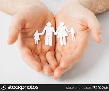 man hands showing family of paper men