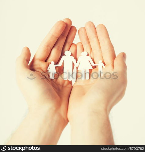 man hands showing family of paper men