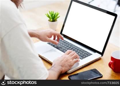 Man hands using laptop computer with blank screen for mock up template background, business technology and lifestyle background concept