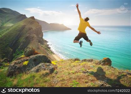 Man happines jump and sea. Emotional scene.