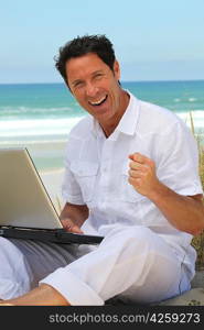 Man happy working on the beach.