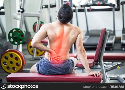 man have injury a back pain after workout in gym,Healthcare concept