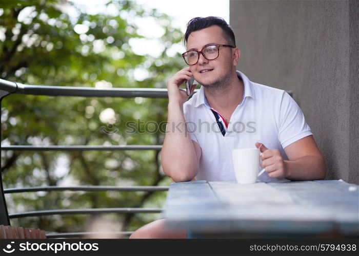 Man have phone conversation during coffee brake
