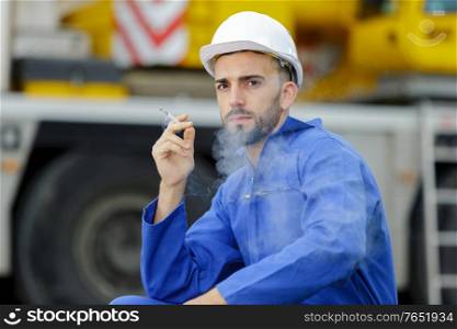 man having a cigarette break
