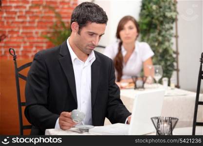 Man having a coffee in a restaurant