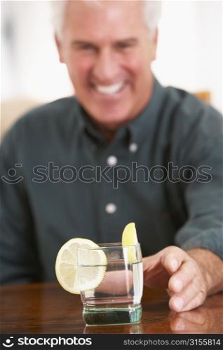 Man Having A Drink At Home