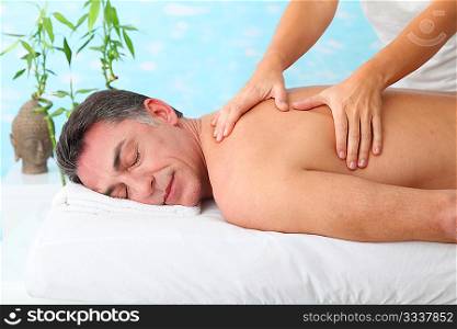 Man having a massage in a spa center