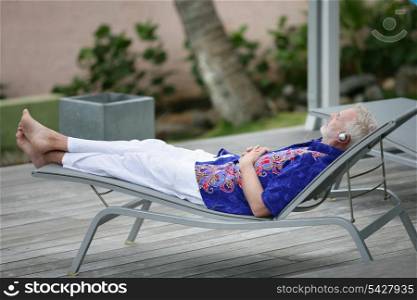 Man having a nap in the garden