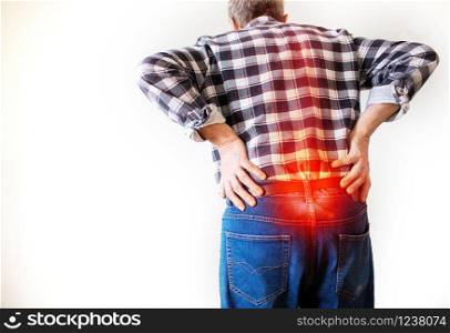 man having a pain in the lower back medical and healthcare