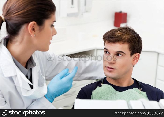Man having consultation with female dentist
