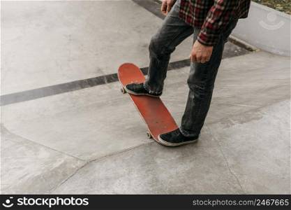 man having fun with skateboard outdoors