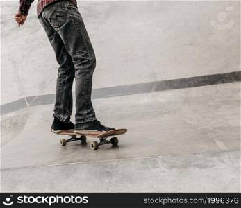 man having fun with skateboard outdoors city park