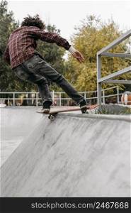 man having fun with skateboard park