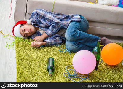 Man having hangover after christmas party. The man having hangover after christmas party