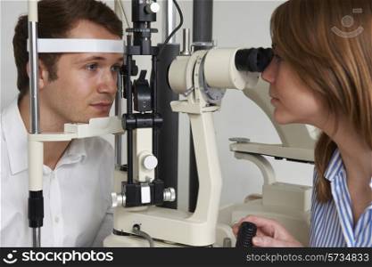 Man Having Sight Test At Optician