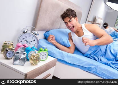 Man having trouble waking up in morning